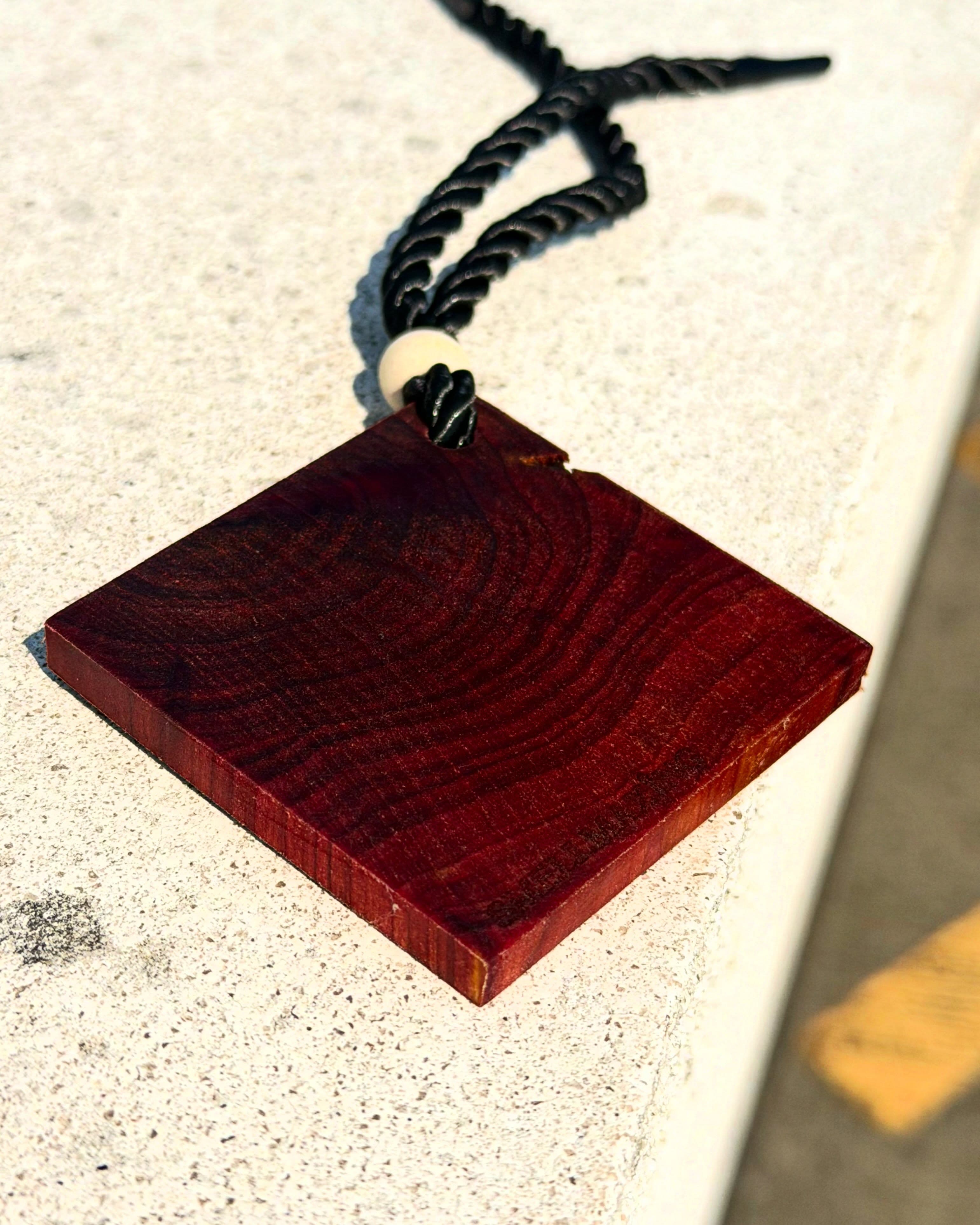 Close-up of the real cedarwood grain on the Cedar Tag